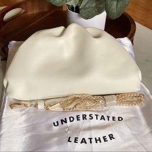 Understated Leather Crescent clutch